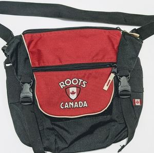 Roots crossbody back with lots of pockets